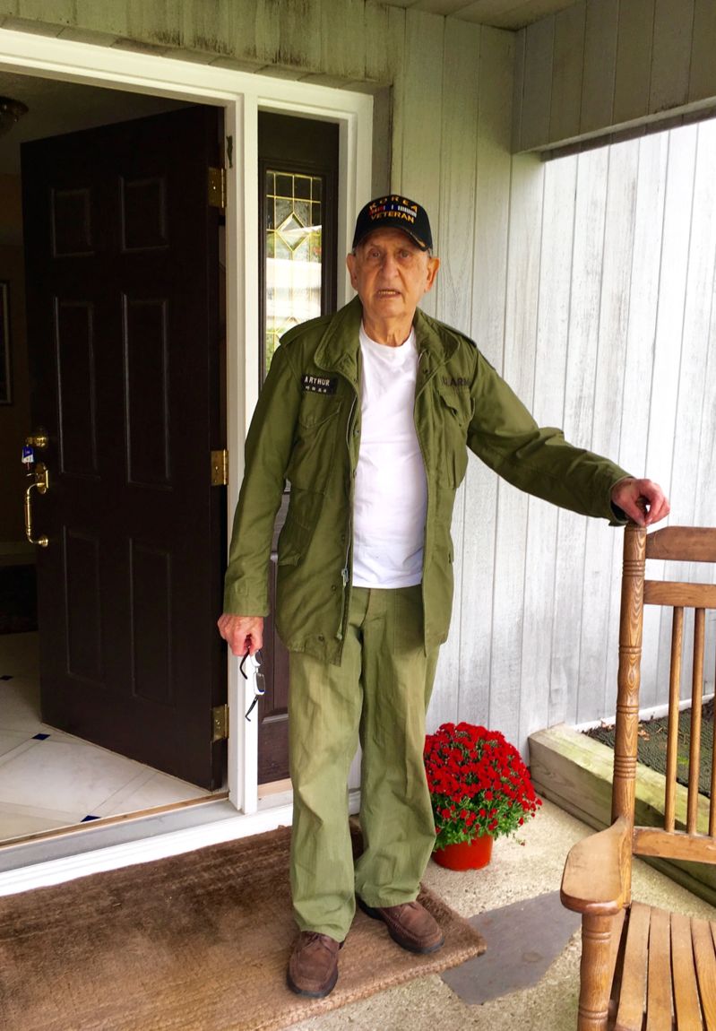 Arthur, founder of International Coconut Corporation, wearing his U.S. Army Korean War veteran cap and jacket